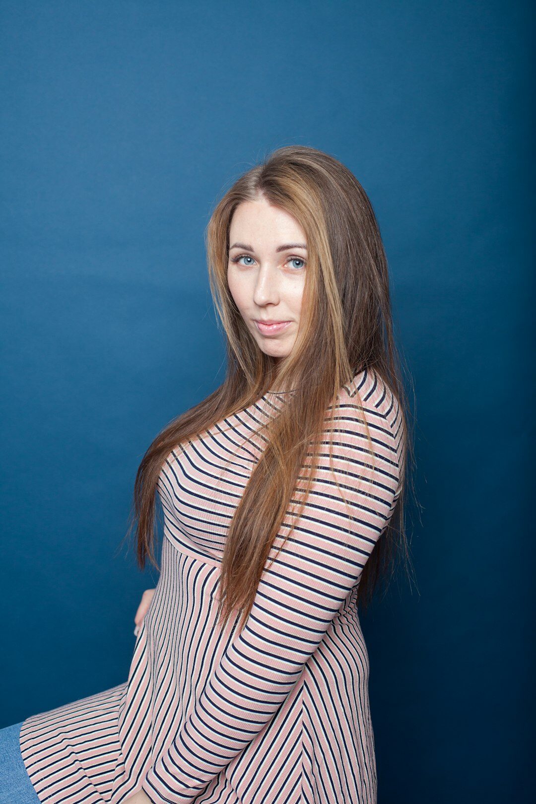 Finnish woman with long brown hair studio portrait