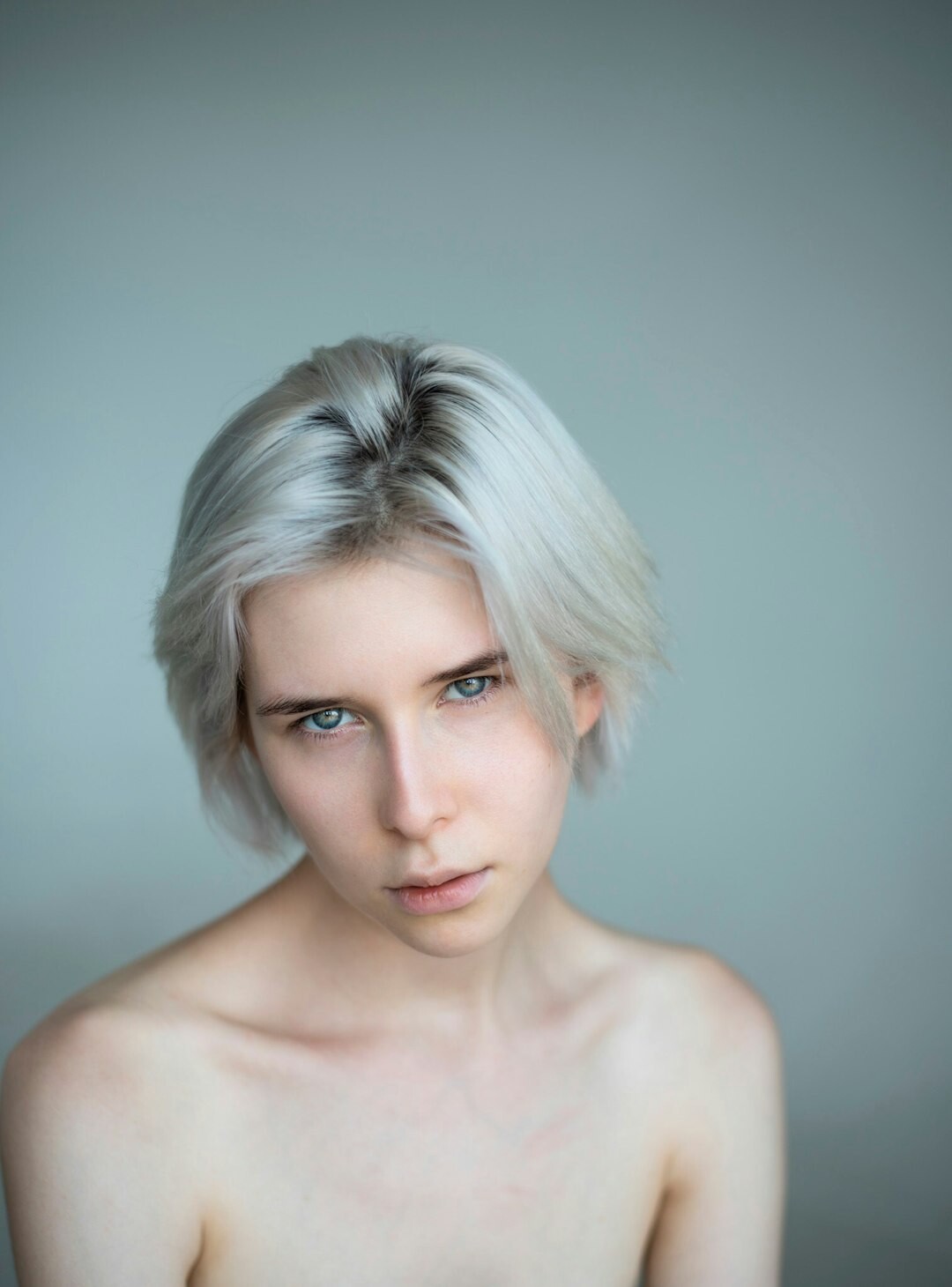 Finnish woman with short blonde hair studio portrait